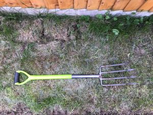 garden fork digging grass